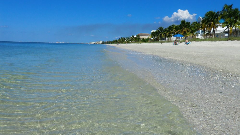 Turquoise water and white sand on a Naples beach